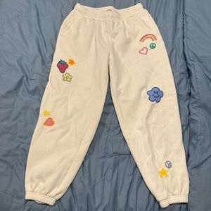 White sweatpants with colorful designs